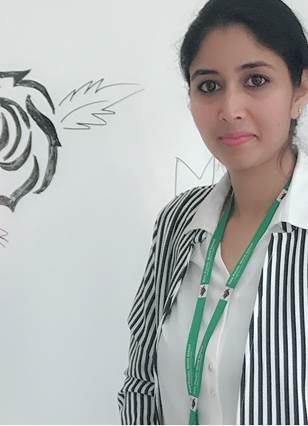 A person standing in front of a drawing

AI-generated content may be incorrect.